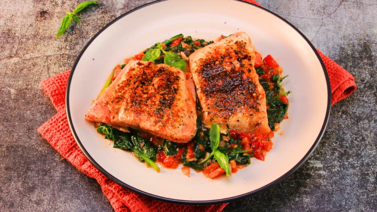 Tuscan salmon recipe UK – crisp-skin salmon with tomato, basil and spinach
