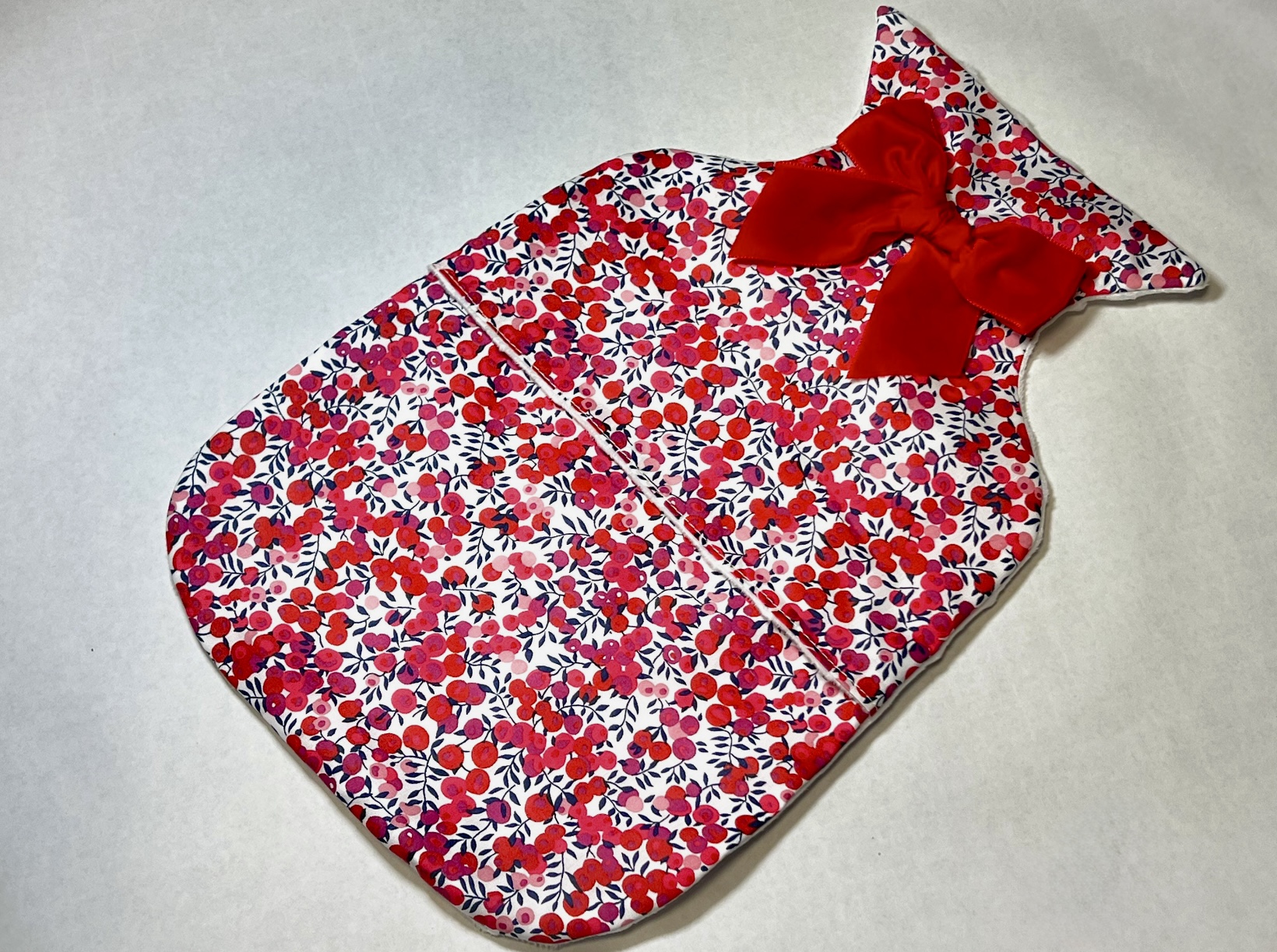 Liberty print hot water bottle cover with red velvet bow