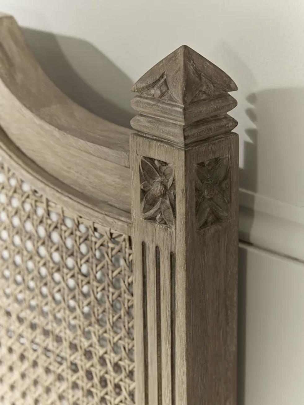 Carved wicker headboard detail in a blue bedroom – blue bedroom ideas