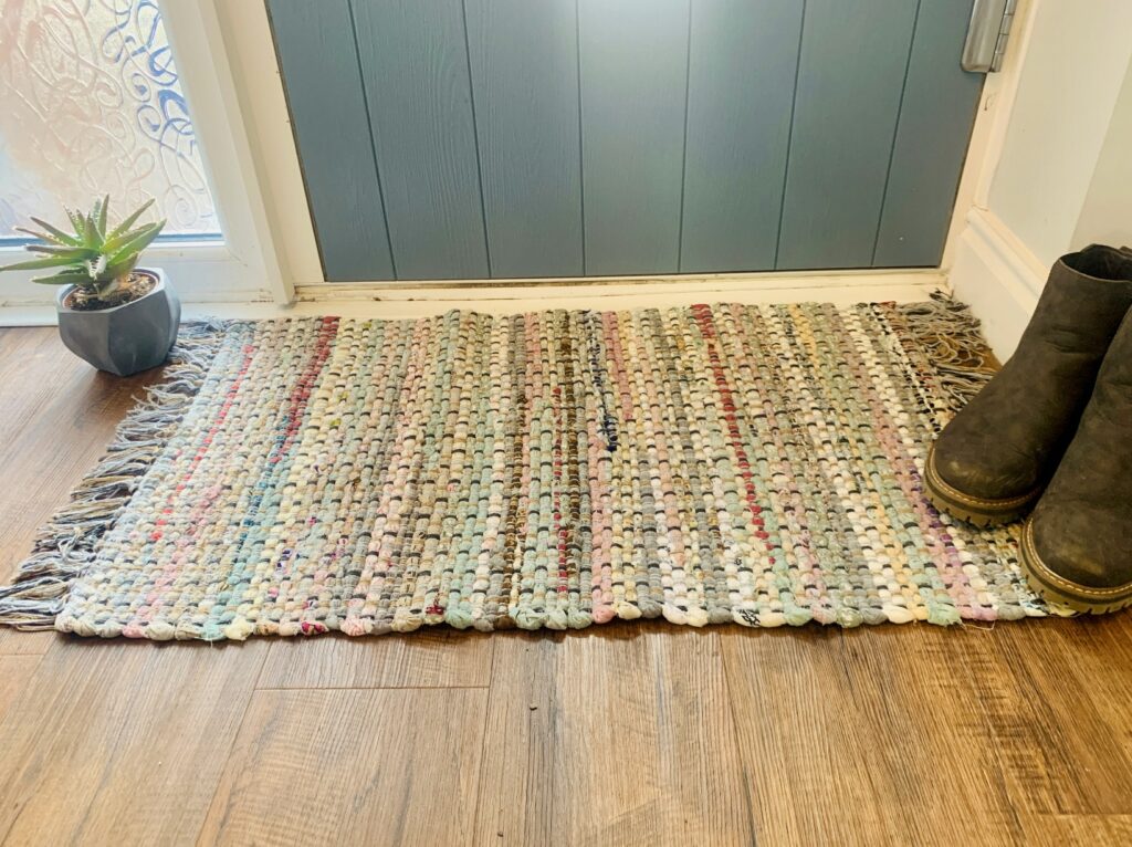 Grey Chindi rag rug made from recycled cotton at a front door