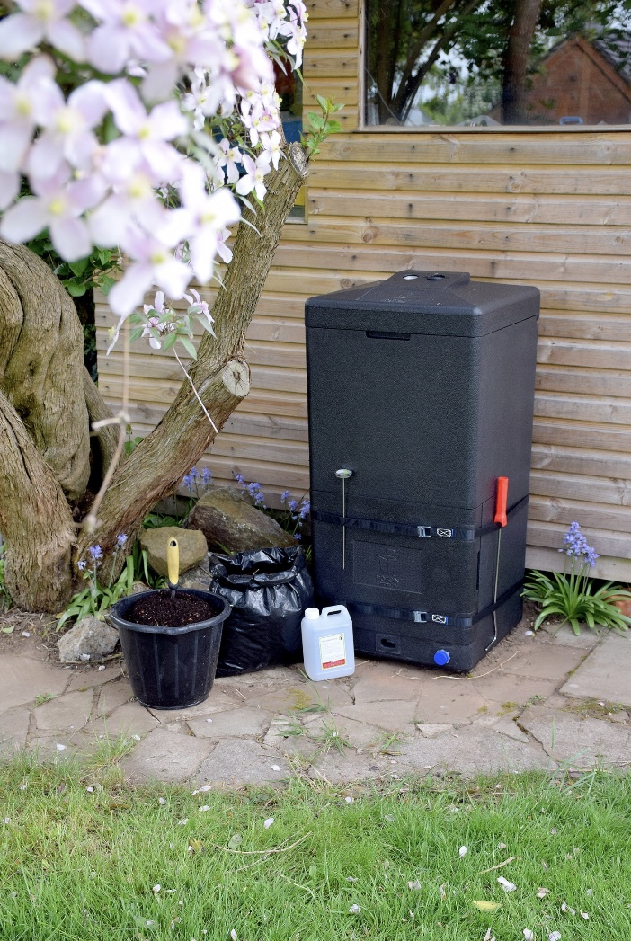 HOTBIN Mk2 200L compost bin beside a timber shed in a UK garden