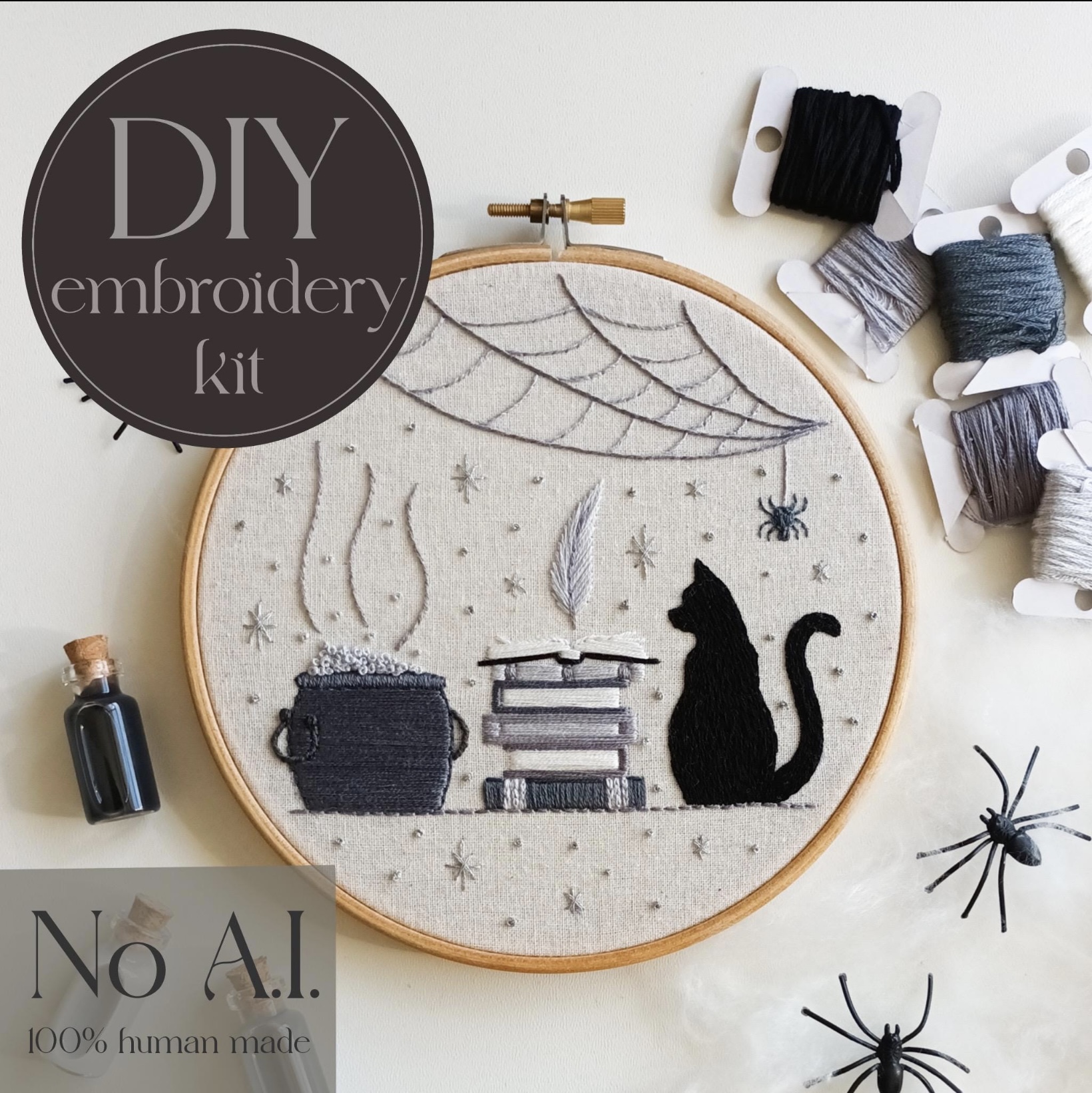 Spooky embroidery kit with hoop, threads and witchy shelf pattern