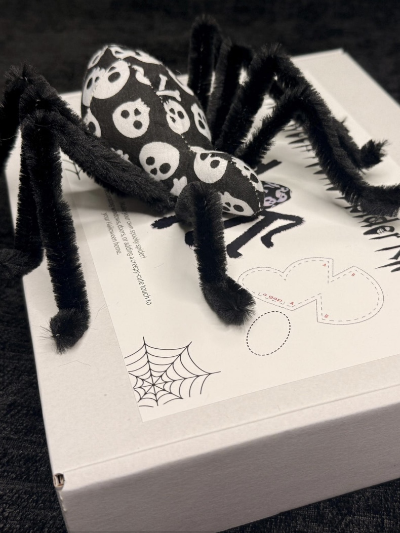 DIY fabric spider kit with patterned body and pipe-cleaner legs