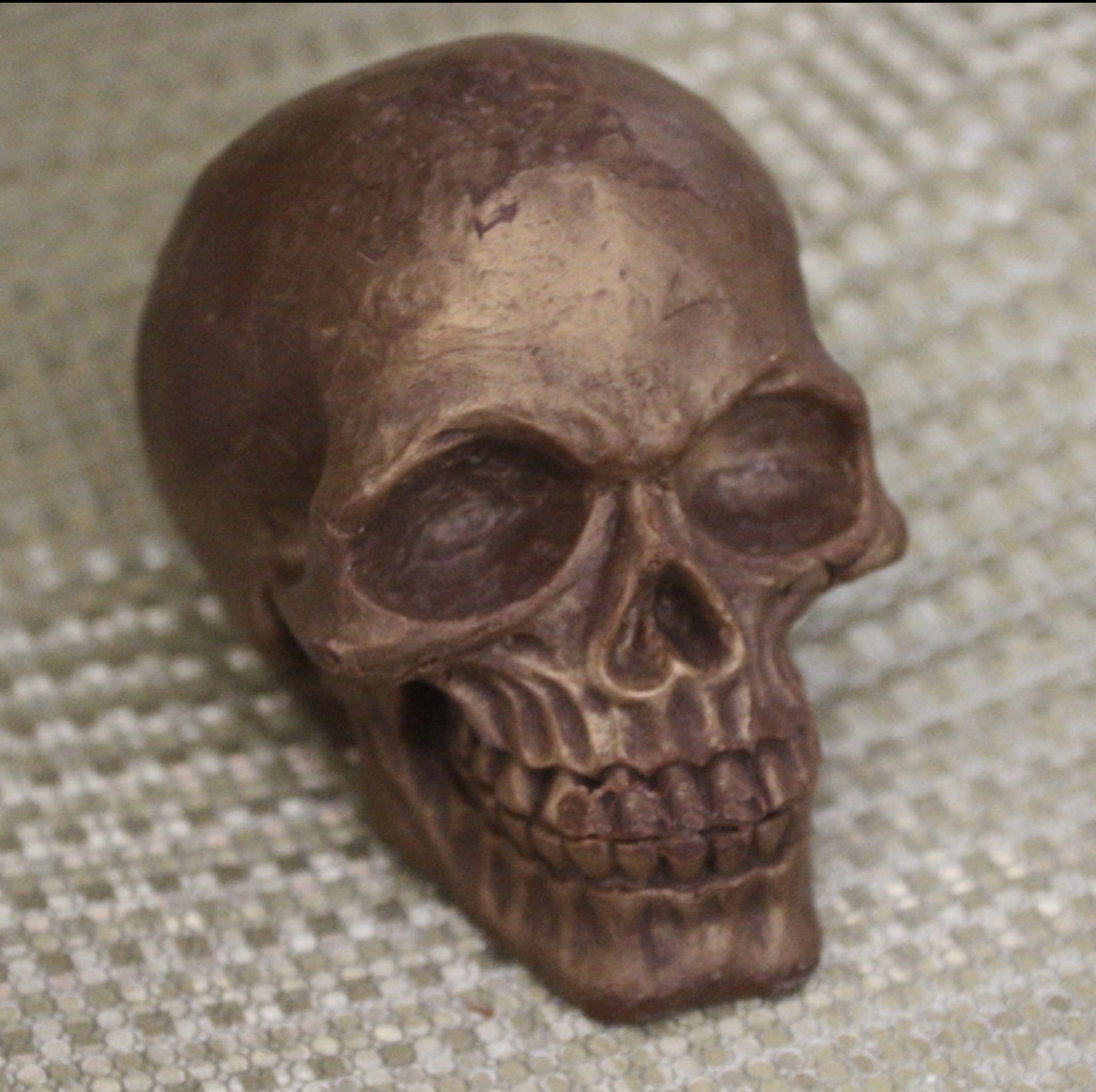 Death by Chocolate bar with mini white chocolate skulls on a rustic table