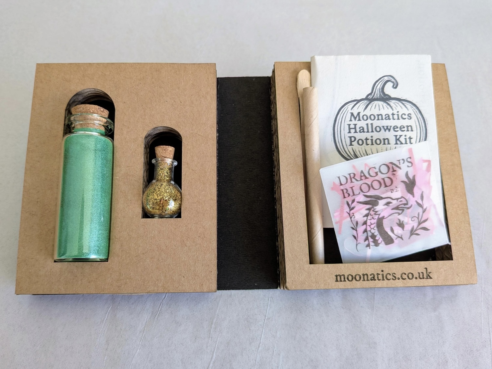 Mini eco potion kit with shimmering green mica and biodegradable glitter in glass vials