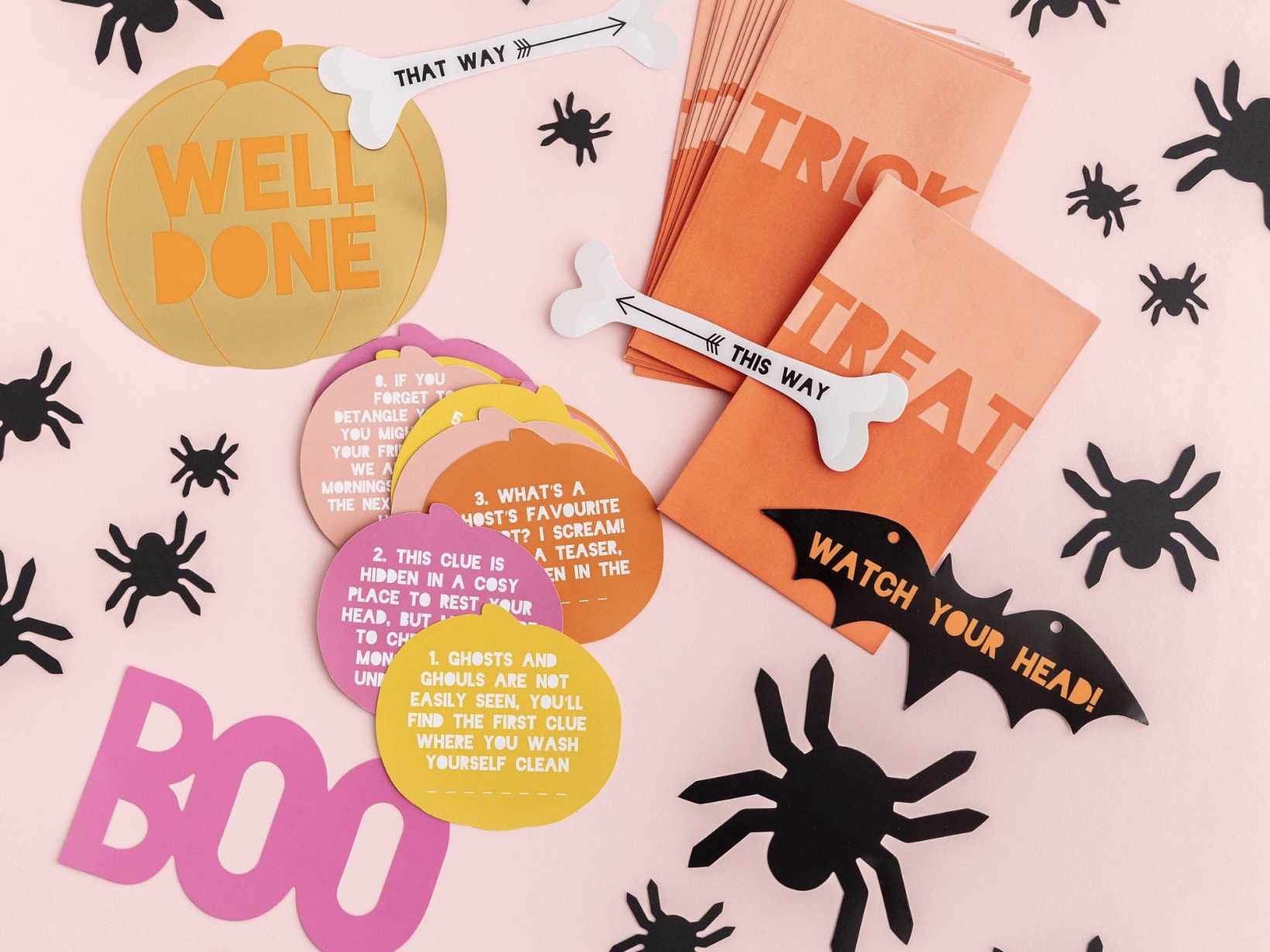 Pumpkin-themed Halloween treasure hunt kit with clue cards, signs, treat bags and spiders