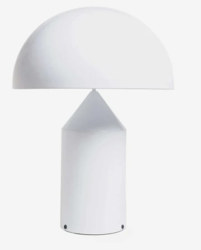 Oluce Atollo lamp on a black console — works well on a modern black console table