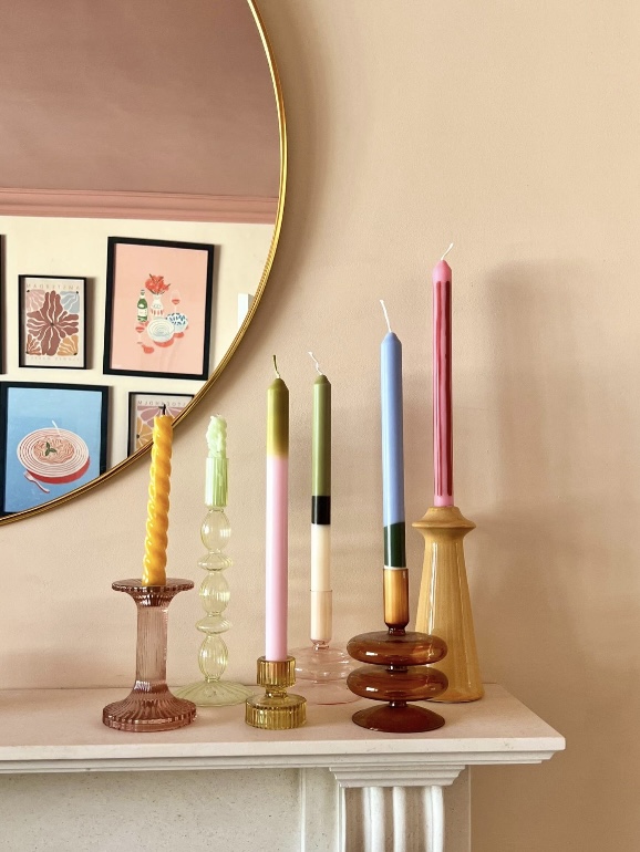 Coloured glass candlestick holders adding light and height