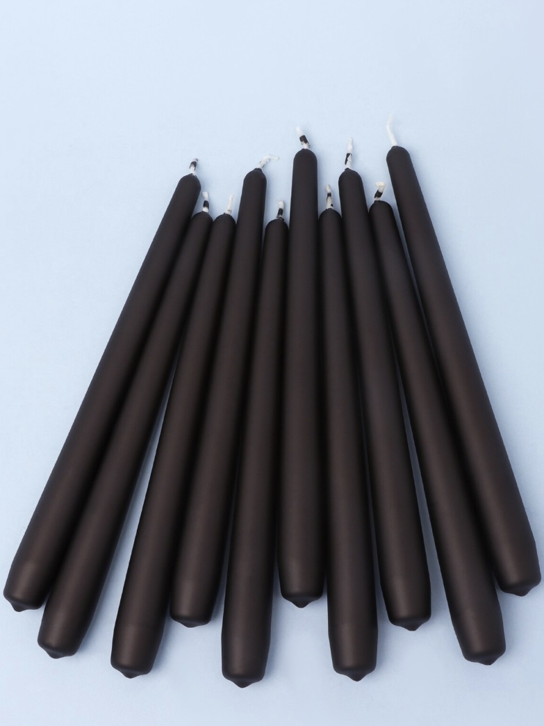 Set of tall matt black taper candles for a sleek modern black console table
