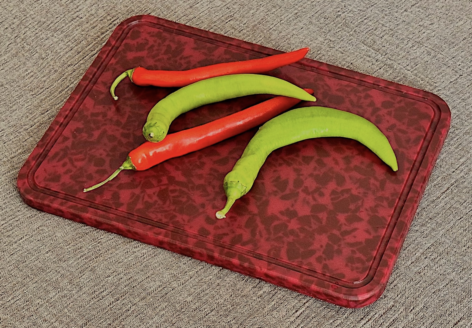 Recycled plastic chopping board with scalloped edge in marbled red finish