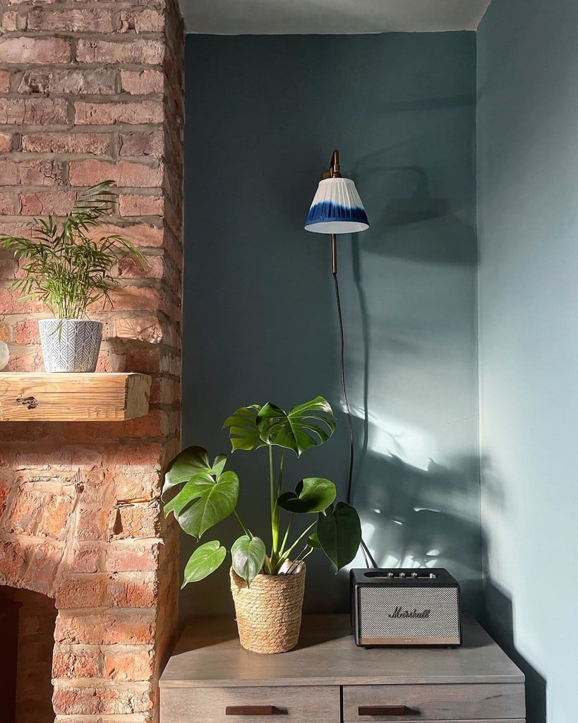 Feng shui colours with Oval Room Blue walls, plants and exposed brick