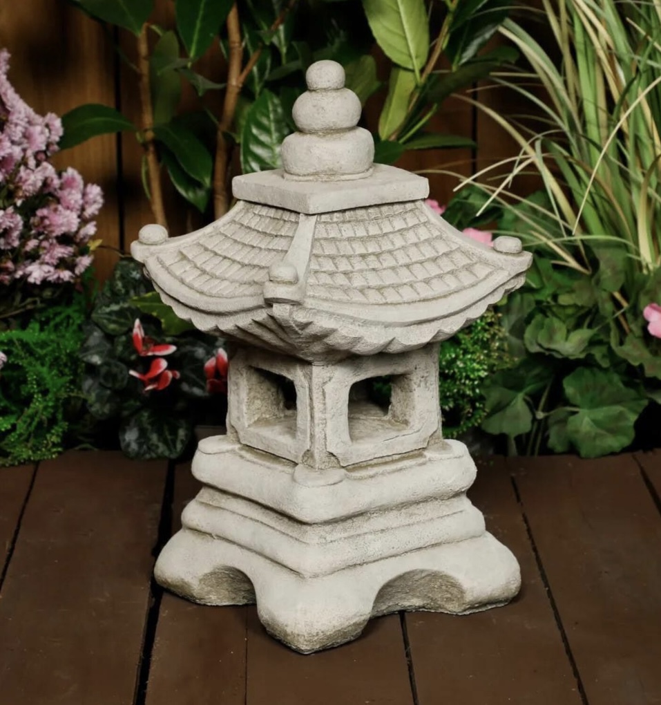 Small Fuji Pagoda with Japanese garden plants in a UK garden