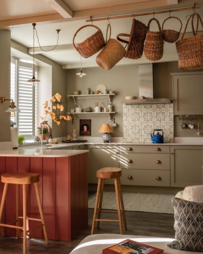 Two tone kitchen with Farrow & Ball Hague Blue island, Strong White shaker perimeter cabinets, veined marble worktop and herringbone oak flooring.​​​​​​​​​​​​​​​​