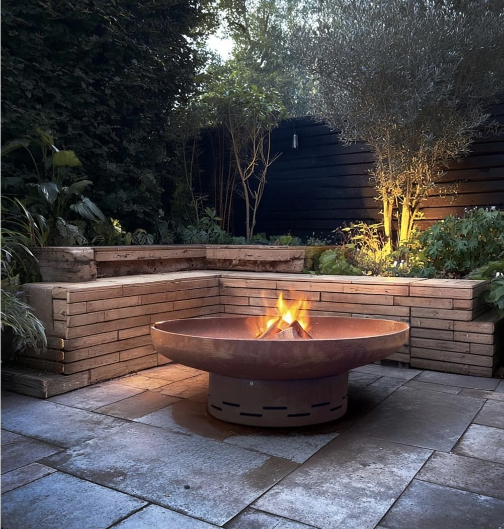 Large corten steel fire bowl as an outdoor firepit centrepiece
