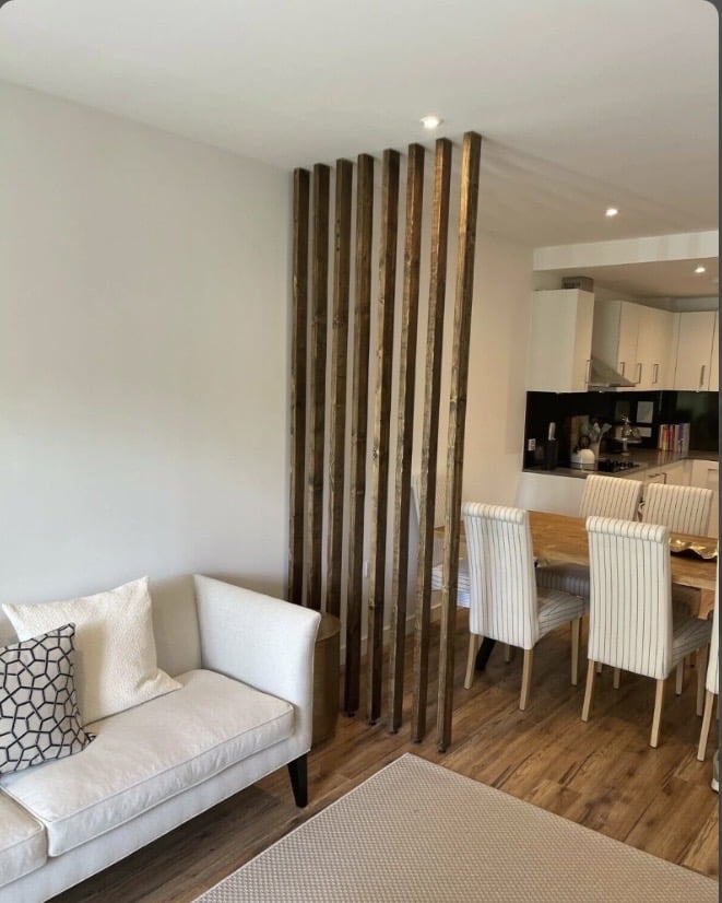 Room divider ideas: RobertRoseCarpentry Georgina wooden wall partition in dark finish separating living and dining areas