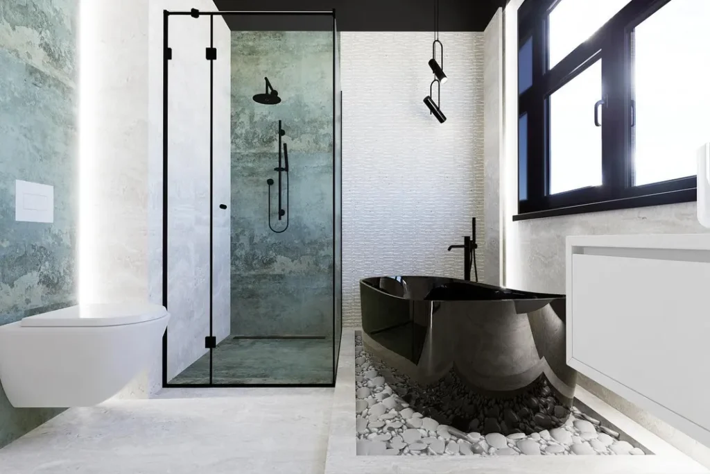 Corner glass shower enclosure with black freestanding oval bath set into a pebble bed and black window frame