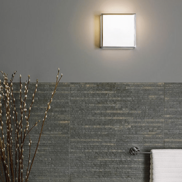 Astro Mashiko Square wall light mounted against grey stacked stone tiling