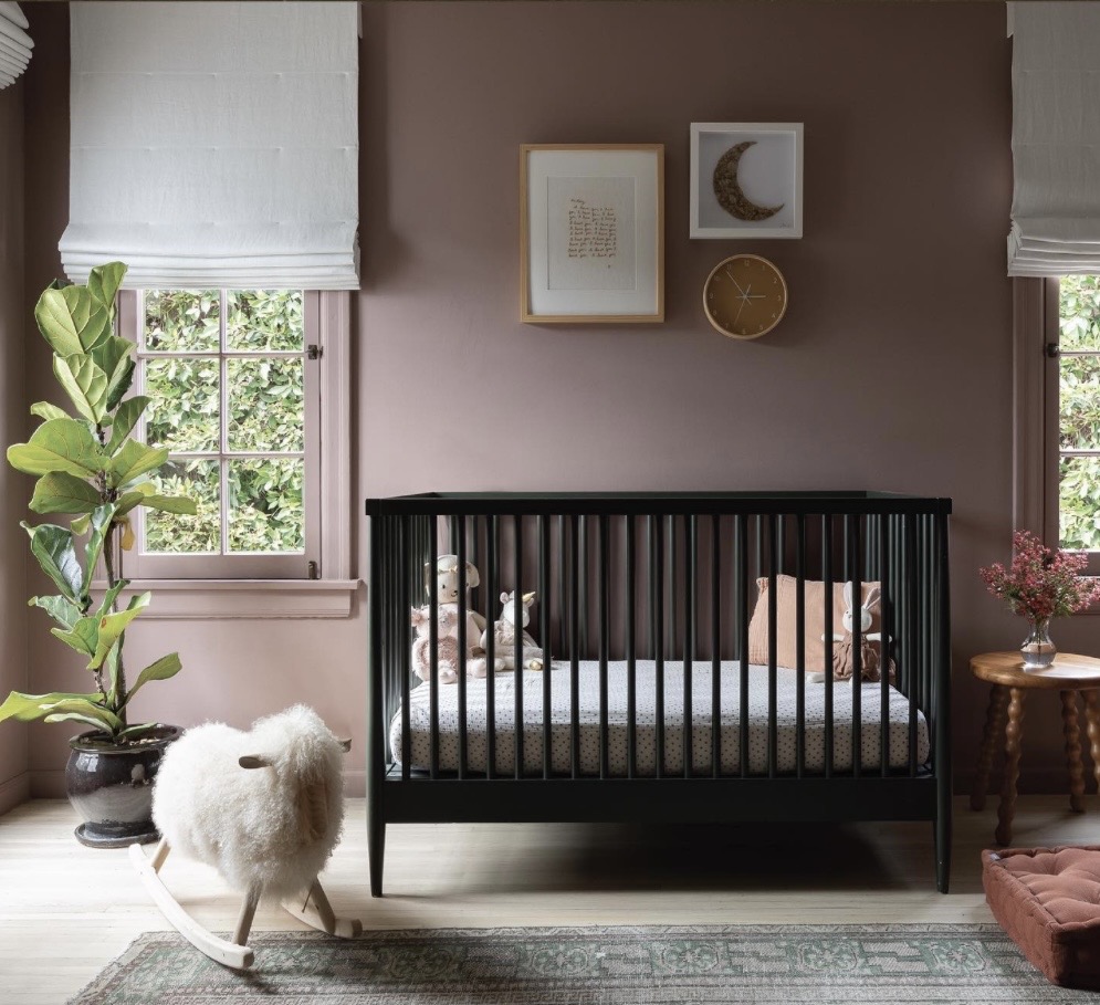 Nursery decor with black cot and Sulking Room Pink walls