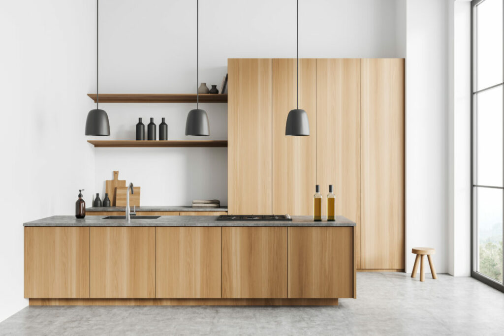 Minimalist kitchen with floating wood kitchen shelves, showcasing sleek floating shelves for kitchens. The open shelving design enhances the warm wood tones, complemented by black pendant lighting and a modern aesthetic.