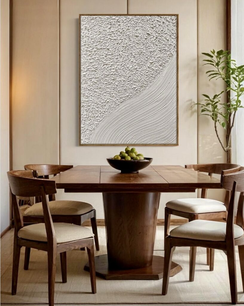 Japandi dining room with vertical wabi sabi wall art and wooden furniture creating a contemporary wabi sabi interior