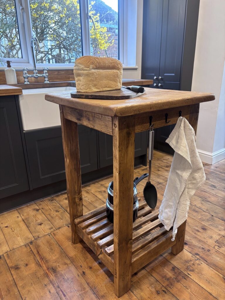 rustic reclaimed wood kitchen island with open shelving