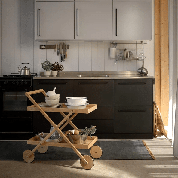 black scandi kitchen with oak kitchen trolley