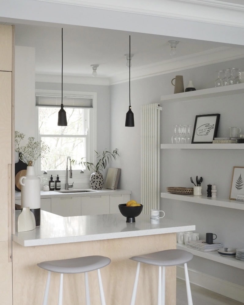 grey scandi kitchen with black pendant lights and open shelving