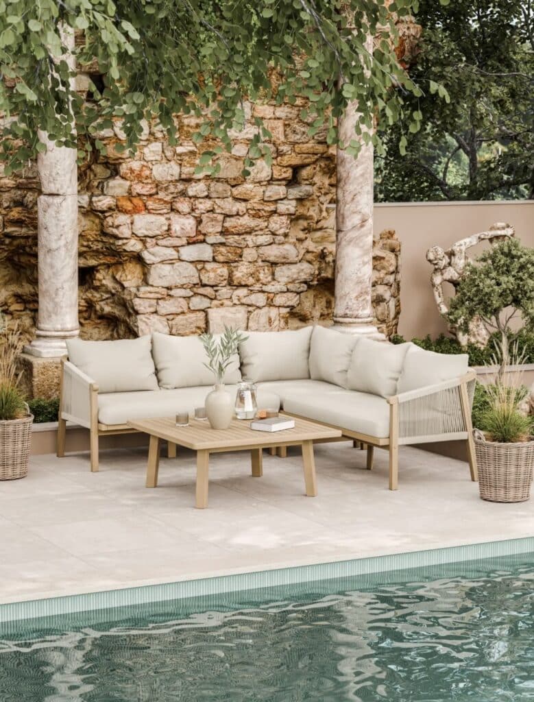 Garden corner sofa with square coffee table showing a 120 cm walkway beside the pool on pale stone paving.