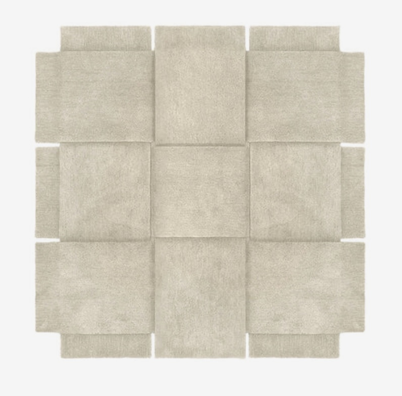 Beige basket-weave rug perfect for styling a green and beige bedroom.