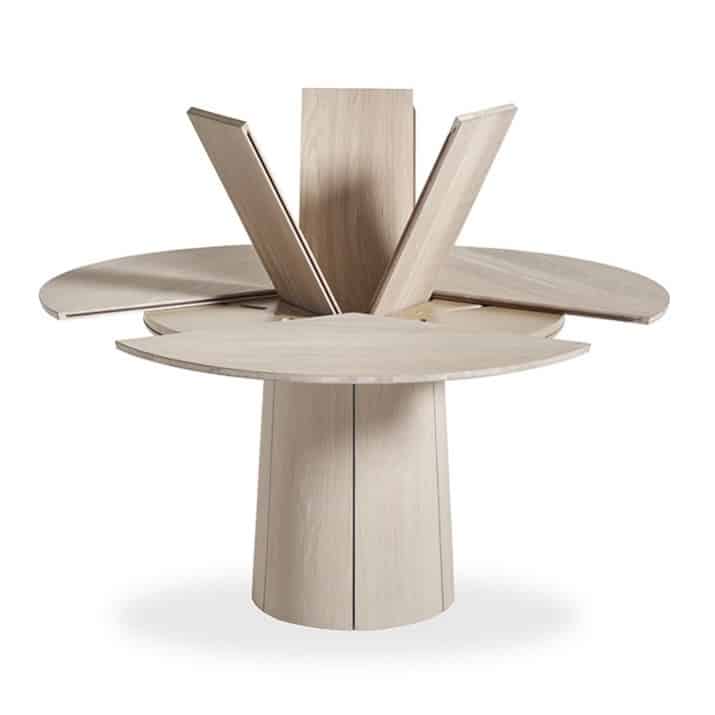 Skovby #33 extending round dining table in pale oak lacquer shown open with extension leaves visible