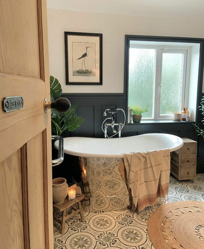 Black and white bathroom with Farrow & Ball Railings panelling, Strong White walls, roll-top bath and patterned floor tiles