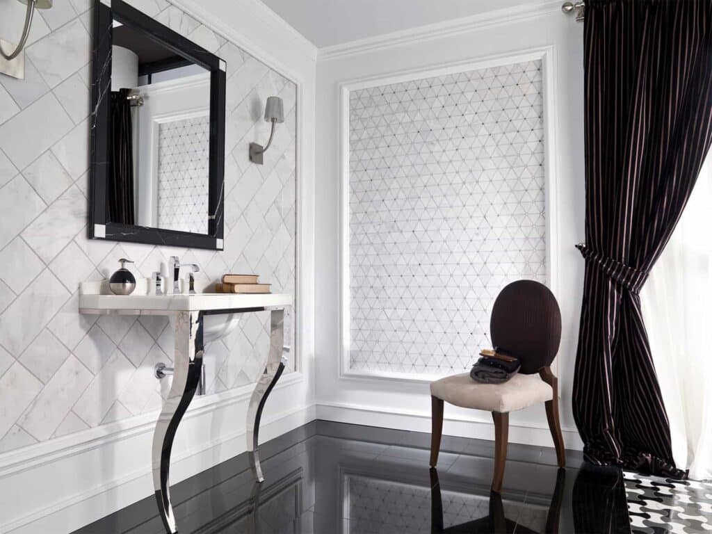 Opulent black and white bathroom with Victorian diamond marble tile and black-framed mirror