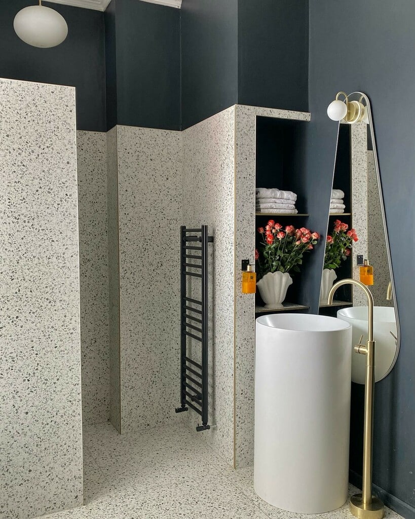 Black and white terrazzo bathroom with Farrow & Ball Railings paint, black towel rail and pedestal basin