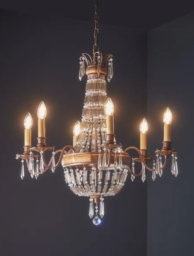 Crystal Inaya chandelier with bronze-effect frame, adding vintage glamour and soft lighting to beige bedroom decor.