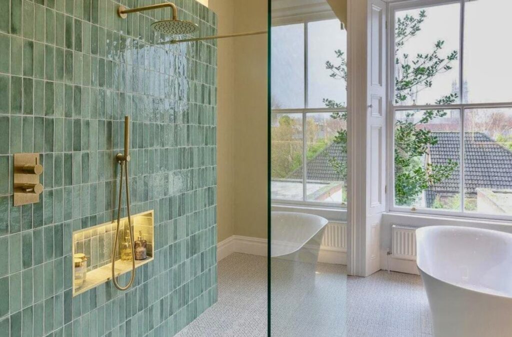 Walk-in shower with Beijing Celadon Gloss Moroccan wall tiles, brass fittings and recessed niche – green bathroom ideas