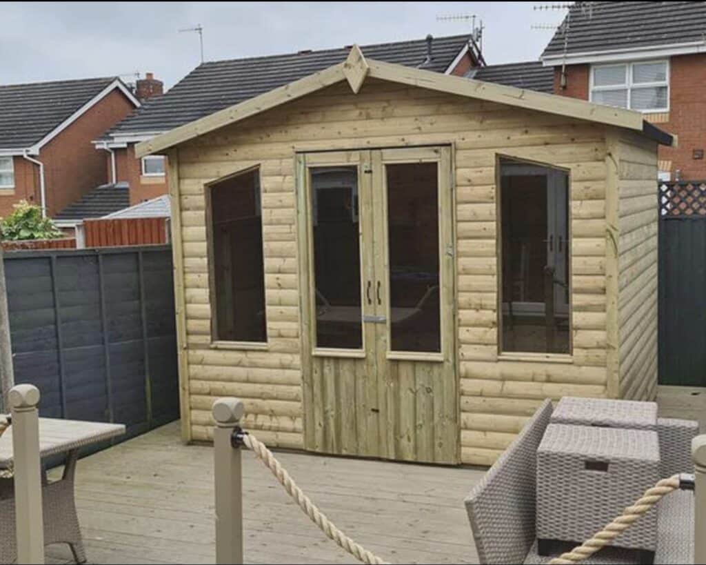 Chatsworth apex roof garden summerhouse with double doors and decking