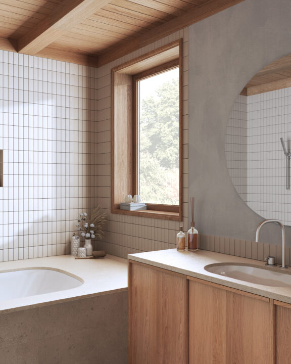 Japandi bathroom featuring a built-in bathtub, natural wood vanity, off-white square tiles, an oval mirror, and soft neutral tones for a calm and minimalist aesthetic.