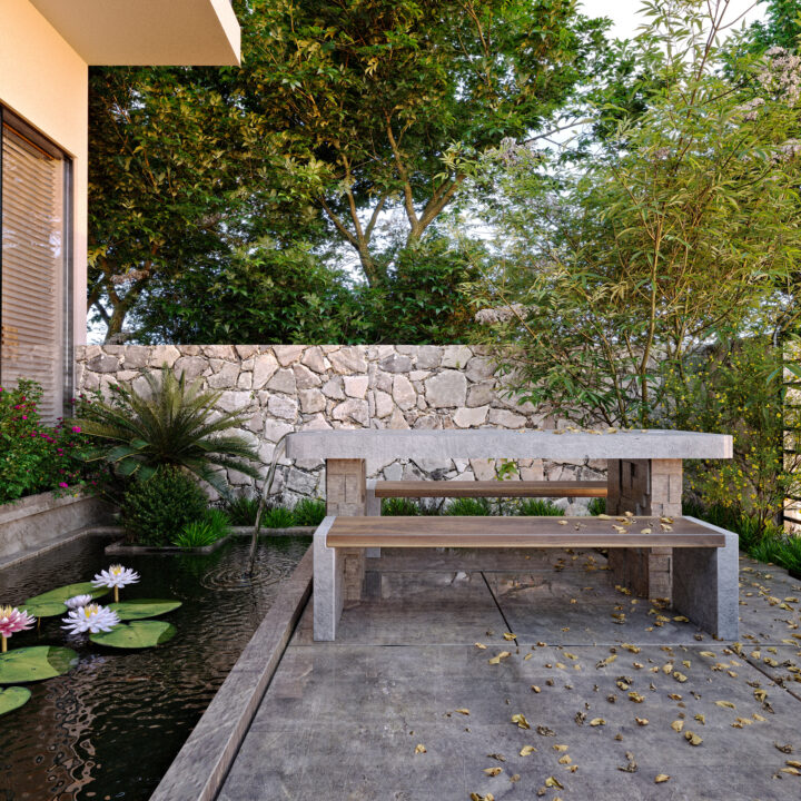 Modern courtyard garden with a stone and wood bench, tranquil water feature with lily pads, and lush greenery. A serene and stylish example of courtyard garden ideas for relaxation.