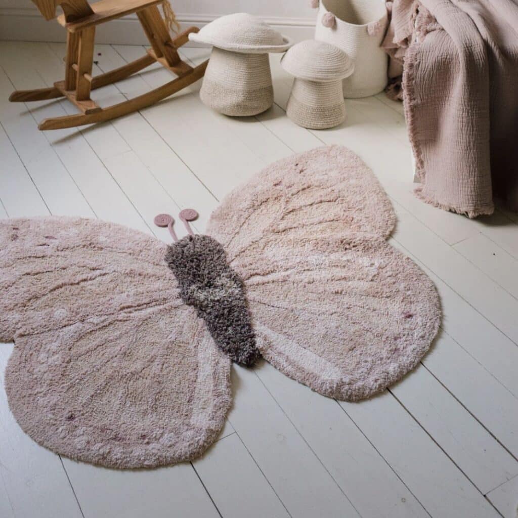 Lorena Canals washable Baby Butterfly rug in pink on white painted floorboards — little girls bedroom ideas