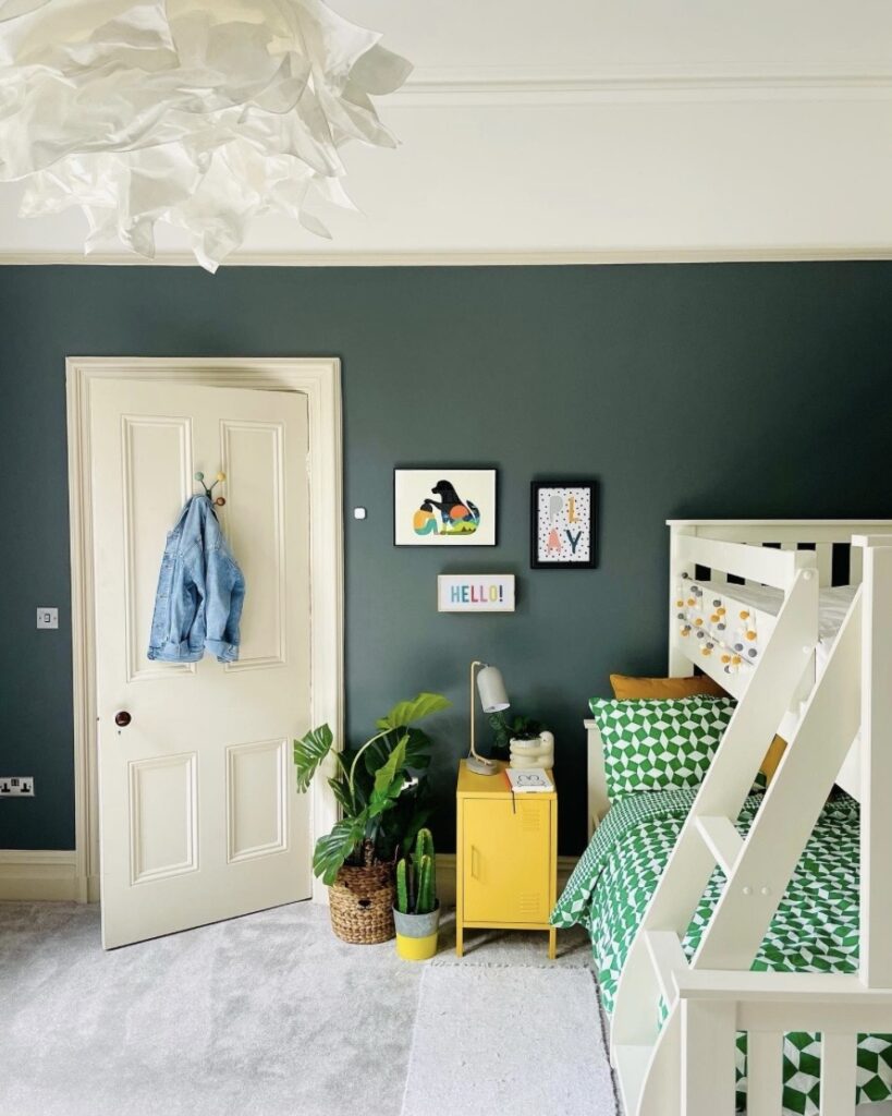 Girls bedroom with Farrow and Ball Down Pipe dark feature wall, yellow Mustard Made locker and white bunk bed