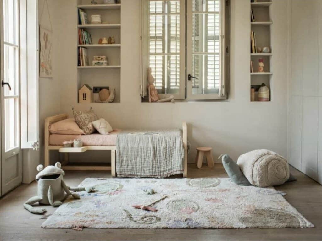 Lorena Canals washable Botanic Fantasy play rug in a Scandinavian girls bedroom with built in shelving — girls bedroom ideas