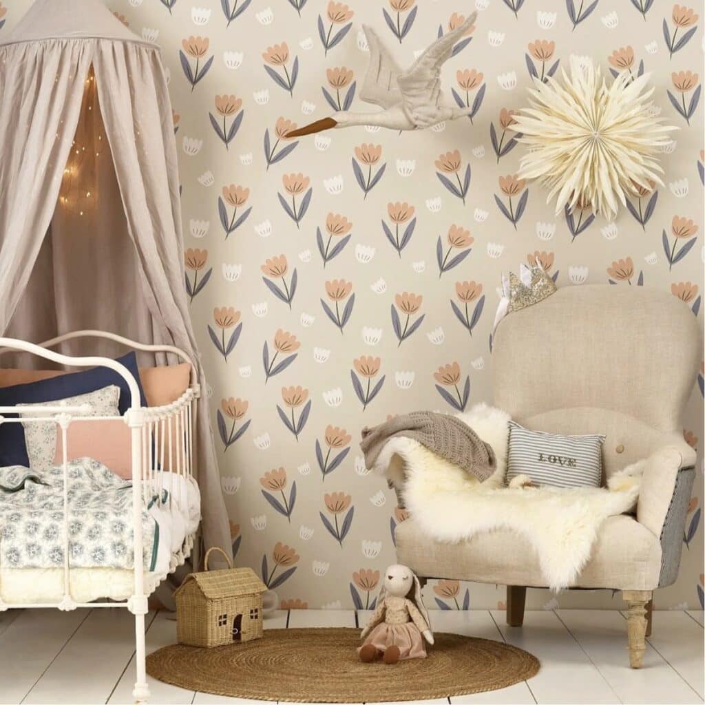 Girls bedroom with Hibou Design Fleur wallpaper in peach and dusky blue, white iron bed and canopy — girls bedroom wallpaper ideas