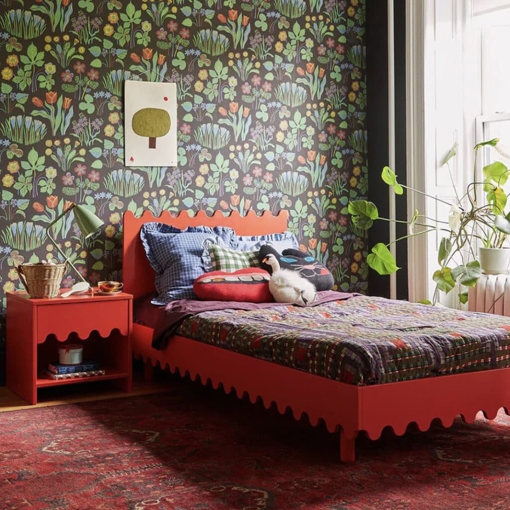Oeuf NYC Moss Twin Single Bed in Tomato red with scalloped edge and dark botanical wallpaper — girls bedroom ideas