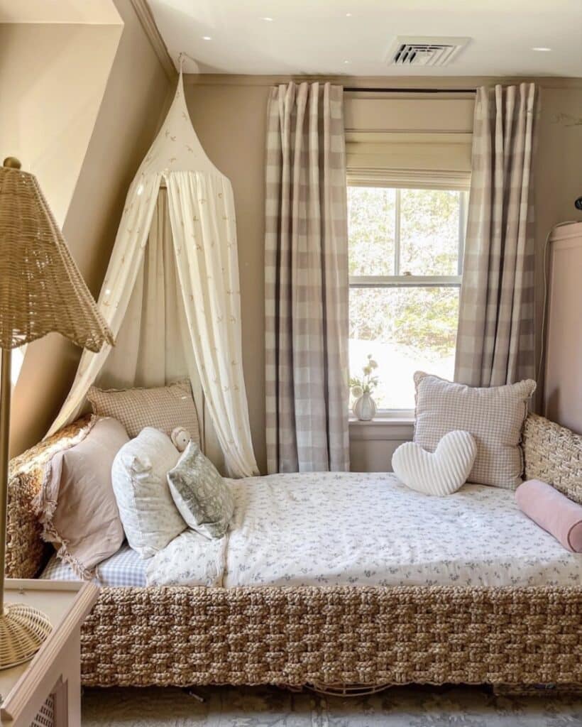 Girls bedroom with Farrow and Ball Sulking Room Pink panelled wall, white wardrobe and gold accessories
