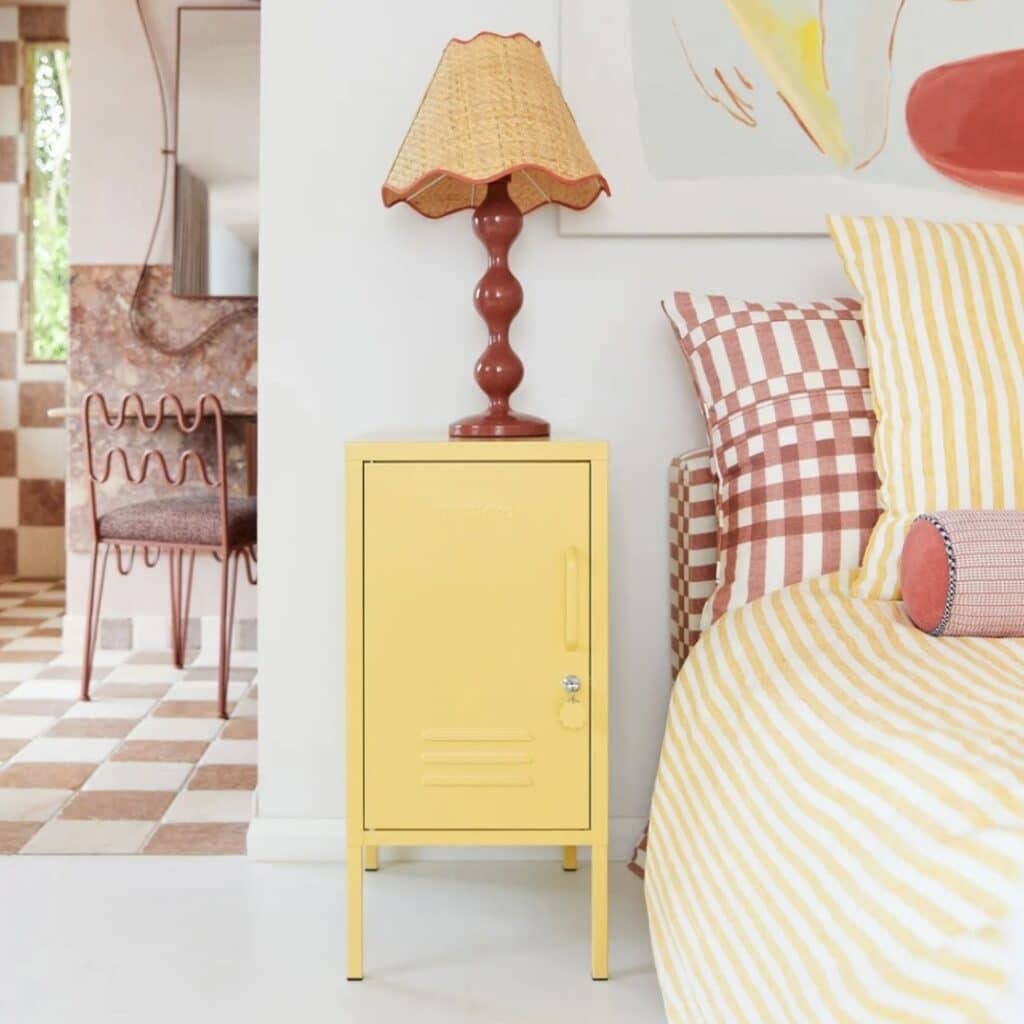 Mustard Made Shorty Locker in yellow used as bedside table with stripe and gingham bedding — girls bedroom storage ideas