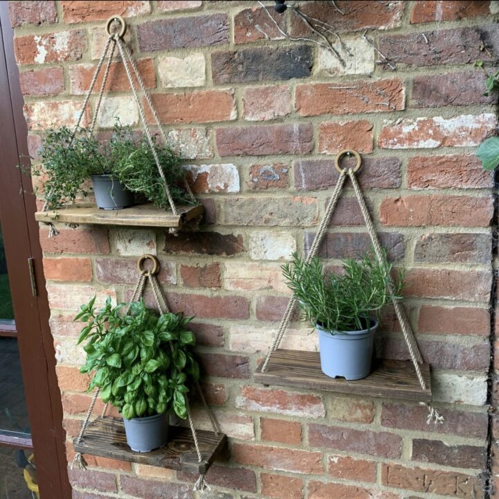The use of Hanging wall planters on a wall are also great courtyard garden ideas