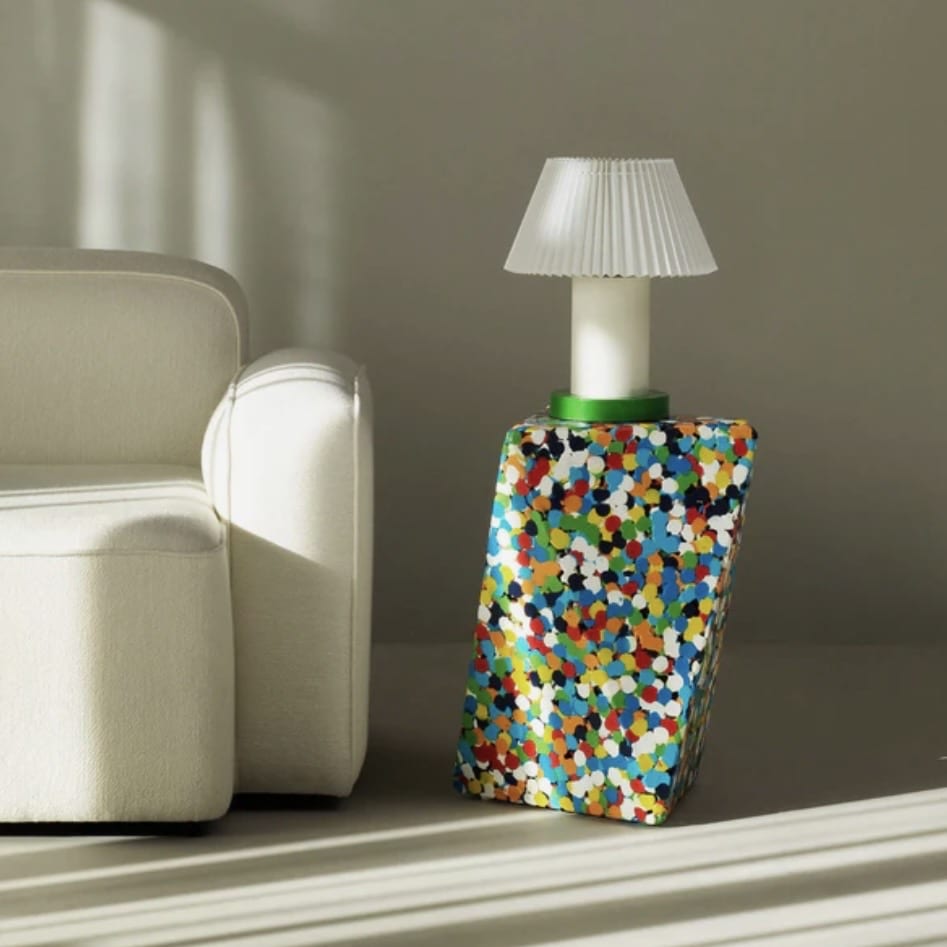 Normann Copenhagen Delta Proust side table with multicolour terrazzo-style surface — a playful unique side table for living rooms.