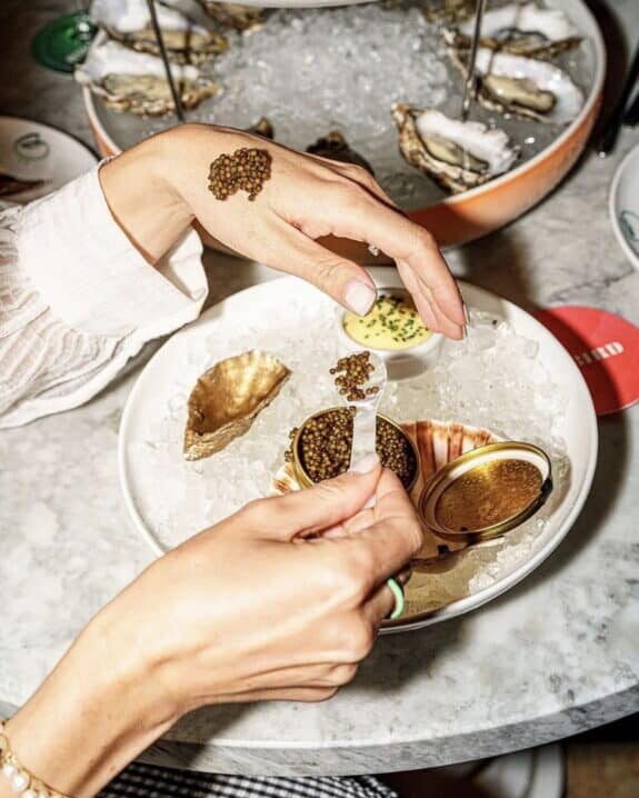 Exmoor Oscietra caviar served on ice with oysters