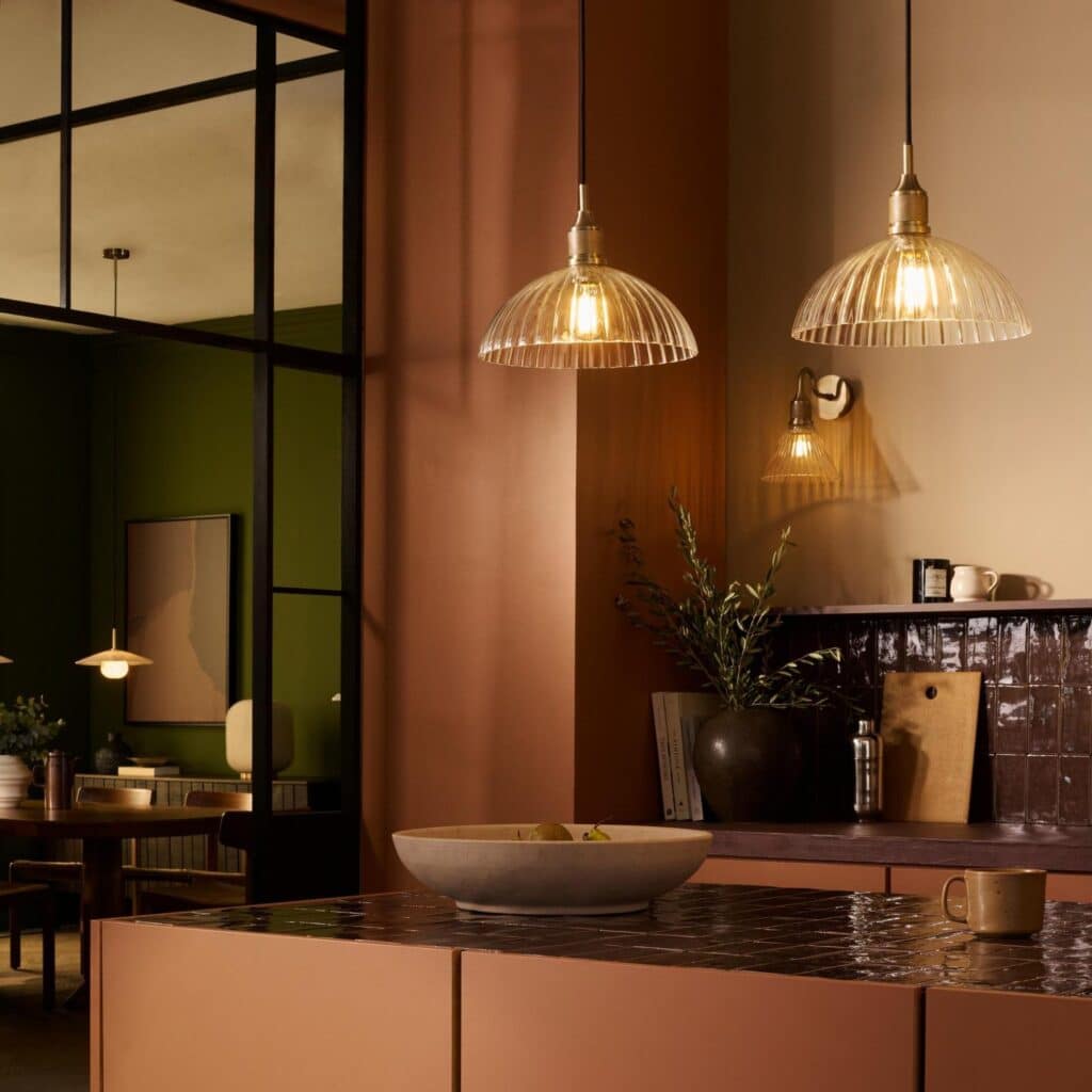 Noho ribbed glass dome pendant lights above a terracotta kitchen island, kitchen pendant lighting from Industville.