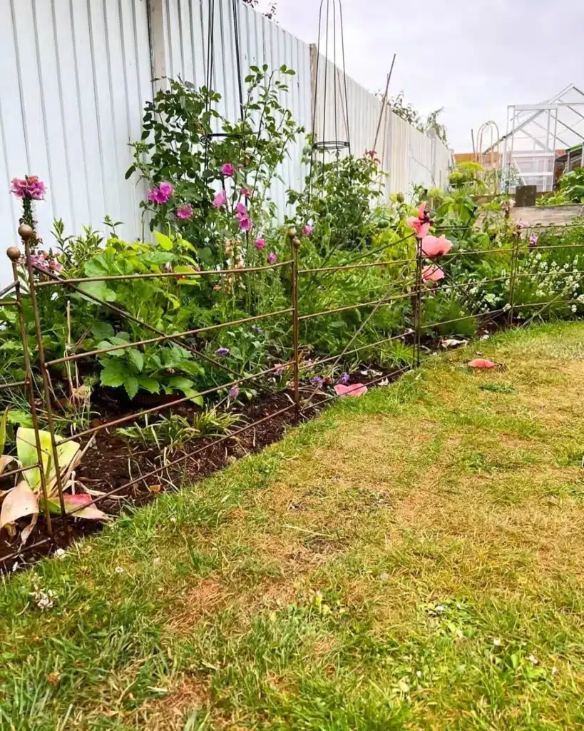 rustic metal garden border fencing handmade rusted steel alongside flower border